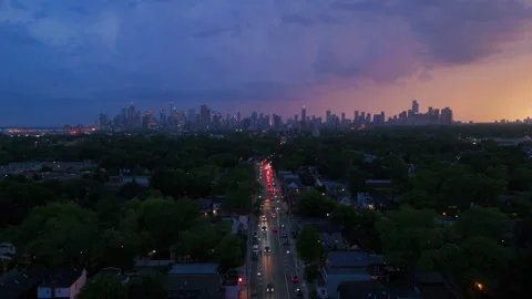 Ominous clouds sit above the Toronto skyline from a thunderstorm at sunset Stock Footage 315699550