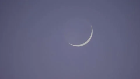 Ominous Crescent moon foreboding scary halloween at blue sky. Mysterious 動画素材 233581449