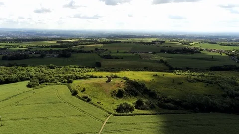 Ominous dark clouds casting shadows over aerial countryside agricultural Stock Footage 109466780