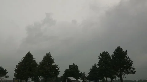 Ominous dark storm clouds on the horizon, black clouds, cumulonibus clouds Stock Footage 40038604
