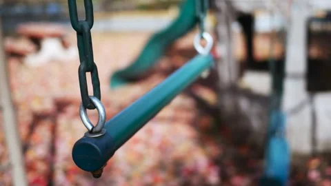Ominous Kidnapping Concept - Empty Swing Swinging in Park 2 Stock Footage 320376184