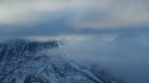 OMINOUS MOUNTAIN PEAK SHROUDED IN CLOUDS Stock Footage 59069761