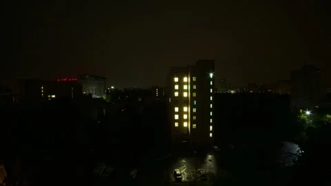 Ominous overcast clouds moving over city during gloomy dawn timelapse Video stock 348090926
