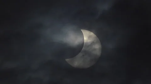 Ominous Partial Solar Eclipse with Deathly Clouds closer Stock Footage 42990058