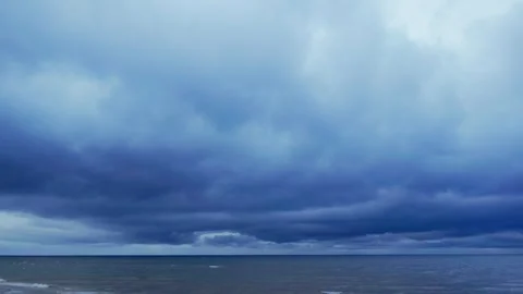 Ominous storm clouds over open Baltic Sea water horizon natural seascape Stock Footage 344355442