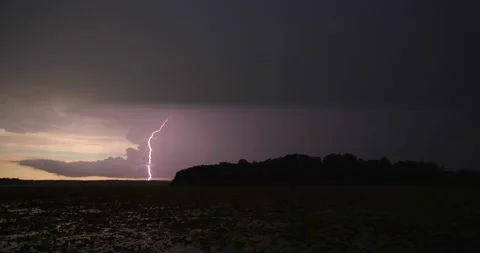 Ominous sunset with one lightning strike Stock Footage 137457361