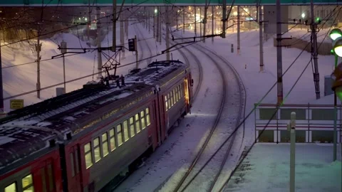 ?ommuter train traffic at night, in the snowfall Stock Footage 168772616