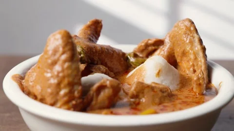 Omo Tuo, Rice Balls With Chicken Wings Peanut Groundnut Soup, Ghana Dish Video stock 346249505