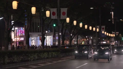 Omotesando avenue adorned by lanterns and national flags of Japan at night. Stock Footage 151591663