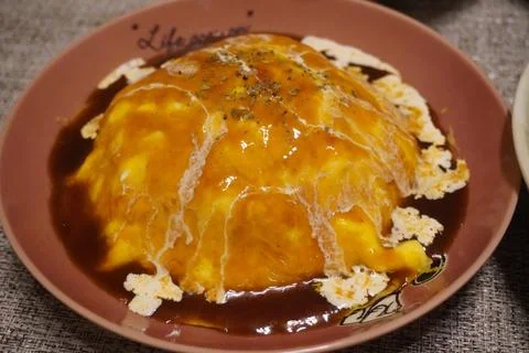 Omurice is an example of y?shoku consisting of an omelette made with fried .. Stock Photos