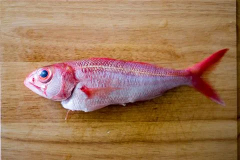 Onaga deep sea snapper on chopping board ready for cooking Stock Photos