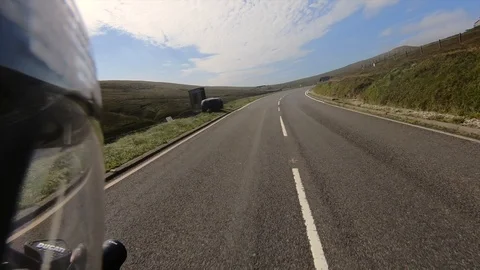 Onboard bike camera going through the Bungalow, TT course, Isle of Man. Stock Footage 102991269