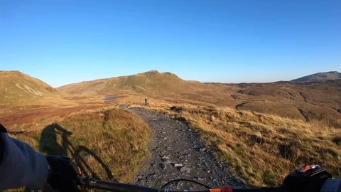 Onboard camera: Mountain biking downhill in stone road in Slate Mountain, Great Stock Footage 103230142