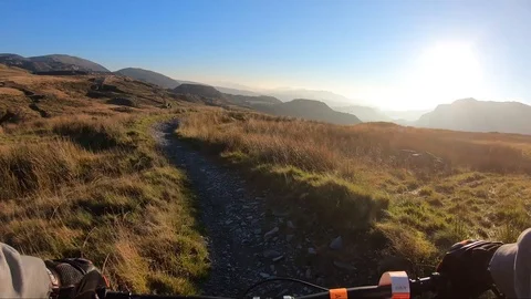 Onboard camera: Mountain biking downhill in stone road in Slate Mountain, Great Stock Footage 103230742