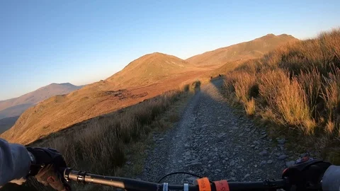 Onboard camera: Mountain biking downhill in stone road in Slate Mountain, Great Stock Footage 103341415
