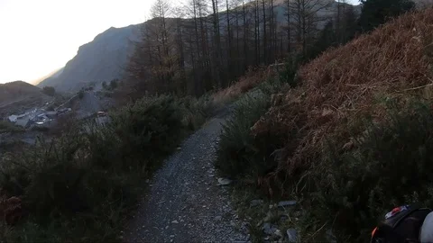 Onboard camera: Mountain biking downhill in stone road in Slate Mountain, Great Stock Footage 107725856