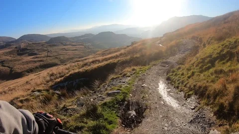 Onboard camera: Mountain biking downhill in stone road in Slate Mountain, Great Stock Footage 107727421