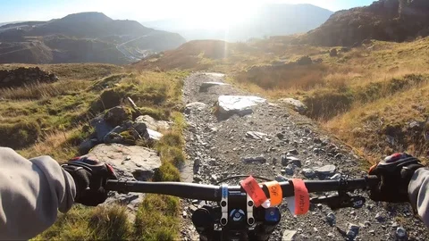 Onboard camera: Mountain biking downhill in stone road in Slate Mountain, Great Stock Footage 107727969