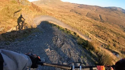 Onboard camera: Mountain biking downhill in stone road in Slate Mountain, Great Stock Footage 107728813