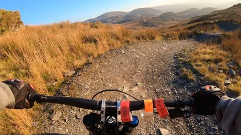 Onboard camera: Mountain biking downhill in stone road in Slate Mountain, Great Stock Footage 107731639