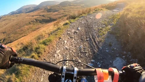 Onboard camera: Mountain biking downhill in stone road in Slate Mountain, Great Stock Footage 107732341