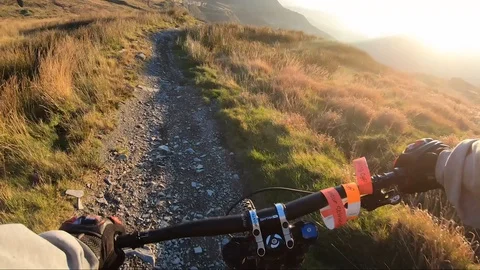 Onboard camera: Mountain biking downhill in stone road in Slate Mountain, Great Stock Footage 107732911