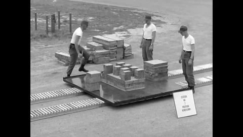 Once students in Parachute Rigging at Fort Benning, Georgia finish rigging a Stock Footage 79514653