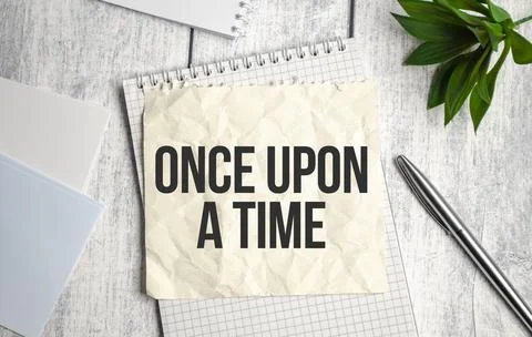 Once upon a time text on documents on table Stock Photos