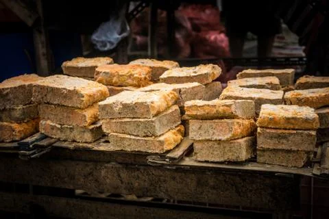 Oncom arranged on top of table made from fermented soy bean sells in traditional Stock Photos
