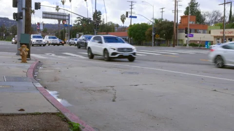 Oncoming Cars Pass Through Intersection Stock Footage 237842711