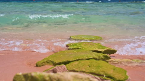 Oncoming sea turquoise wave, red sand. wave splash. Stock Footage 154654539