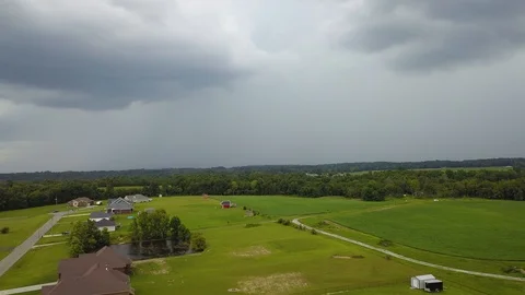 Oncoming thunderstorm with lightning strike aerial drone 스톡 동영상 94354697