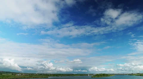 Oncoming white cumulus clouds over landscape Stock Footage 53315978