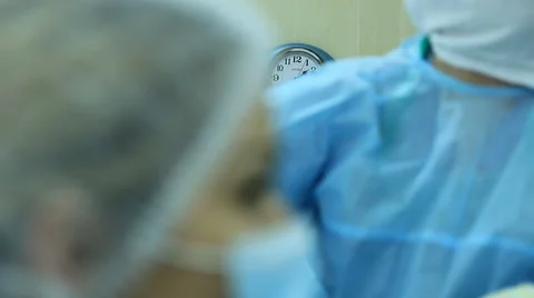 Oncosurgery: The clock in the operating room and surgeon's view Video stock 40059990