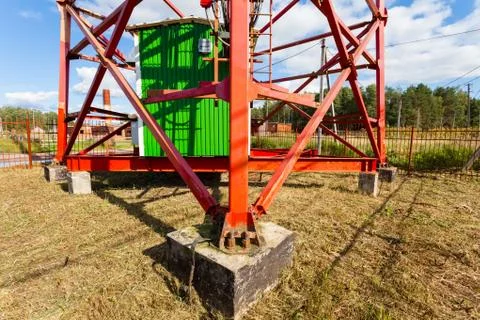 Oncrete base of telecommunication tower with panel antennas and radio antennas Stock Photos