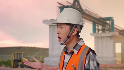 Ondering Engineer Saying Why Working Doubtfully at Construction Site Stock Footage 330331593