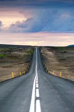 Ondulated and empty road in the sub-artic icelandic landscape Stock Photos