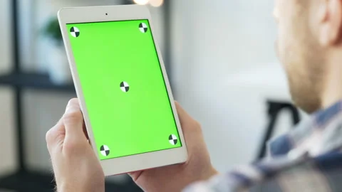 One 30s person using tablet with touching screen for internet surfing on-line an Stock Footage 199490154