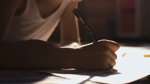 One adorable boy draws on floor at home, close-up of his hand Stock Footage 66298885