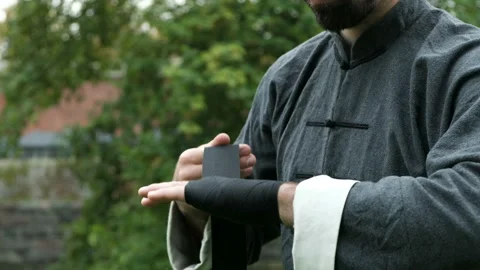 One adult warrior preparing for practicing kungfu technique exercise and showing Video stock 199492604