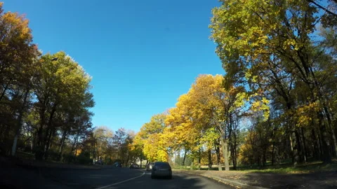 One after another the vehicles are driving the winding route Stock Footage 106945231