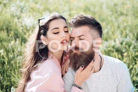 One and only. Sensual woman hug bearded man on summer meadow. Lost in love and Stock Photos