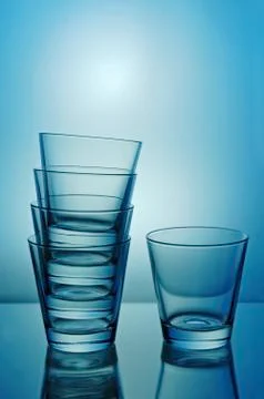 One and stack of glasses Stockfoto's