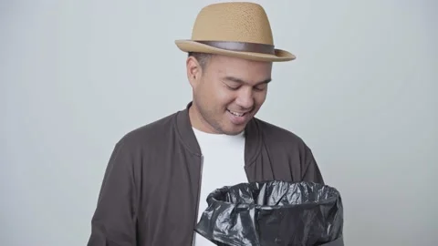 One Asian man separates waste Separate plastic bottles for proper disposal. And  Stock-Footage 145177192