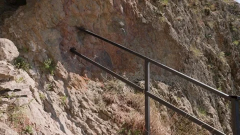 One bald guy is hiking in the mountains on a sunny bright day Video stock 248868401