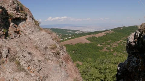 One bald guy is hiking in the mountains on a sunny bright day Video stock 248868637
