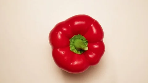One bell red pepper. Rotating on the turntable. Isolated on the white backgr Stock Footage 127573816