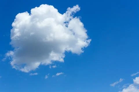 One big cloud in the blue sky Stock Photos