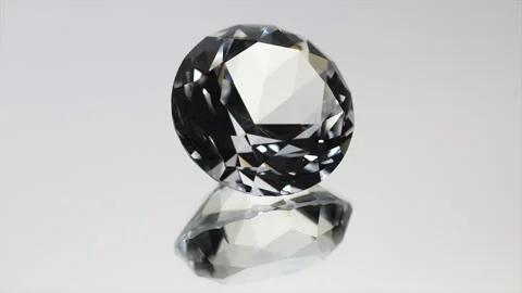 One big round crystal, clear Diamond rotating over grey background Stock Footage 315666247