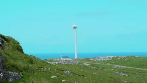 One Big Wind Mill Turns Next to The Ocean Stock Footage 156326674
